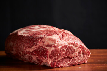 raw meat on wooden board