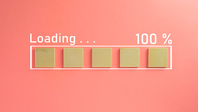wooden cube with loading 100% progress bar over pink pastel background with copyspace and minimal style use for screen,background concept.