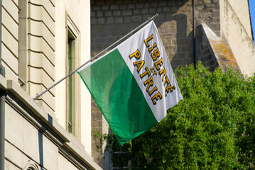 Flag of canton de vaud at the old town of Payerne. Photo taken June 11th, 2021, Zurich, Switzerland. - obrazy, fototapety, plakaty