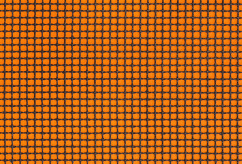 Close up of grill mat grid texture. Black mesh on the orange poster board