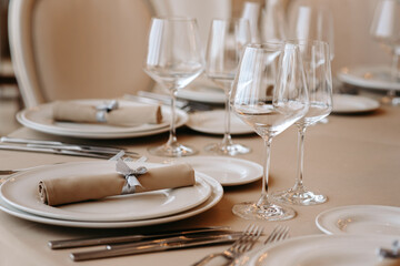 Served dinner table in a restaurant. Restaurant interior, table setting for a dinner