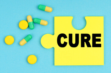 On a blue background, there are pills and a puzzle with the inscription - CURE