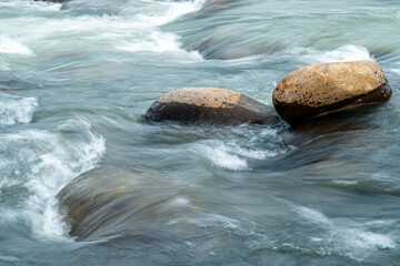 Rapid and powerful water flow between rocks