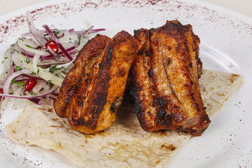 Grilled pork steak with bone