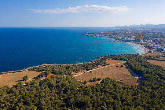 An aerial panoramic view on Sa Coma beach on Mallorca island in Spain at evening time