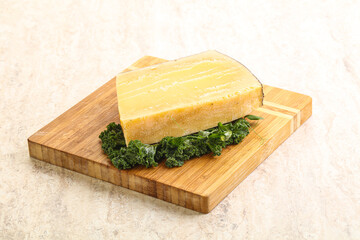 Parmesan cheese piece over board