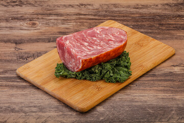 Beef ham piece over board