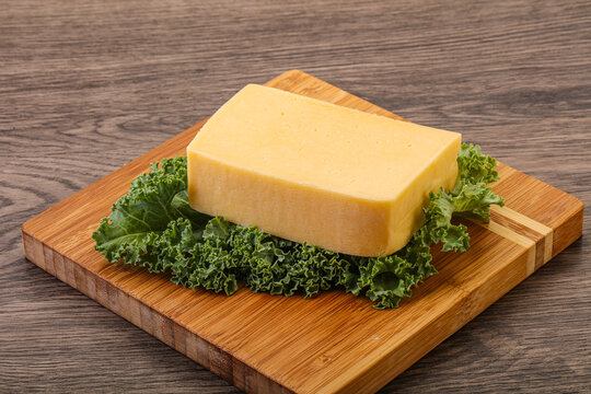 Tasty yelloow Tilsiter cheese brick