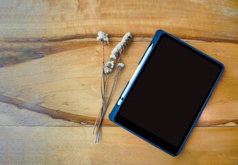 Top view of tablet computer on wooden background, empty space, nobody. Concept of office document  planning on screen of digital tablet and pen. A global communication of wireless technology. - Powered by Adobe