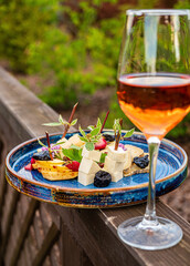 cheese plate and glass of wine