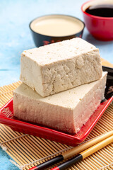 Soy curd (tofu) in a ceramic bowl.