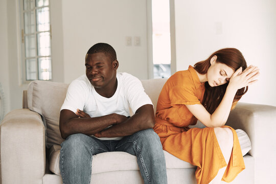 Young Couple At Home On The Couch Resentment Conflict Quarrel