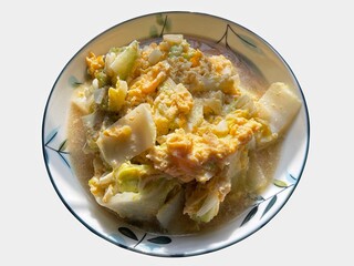 Stir Fried Cabbage,Fried lettuce with egg in a plate, white background