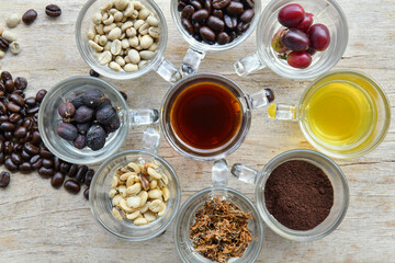 Many cups of coffee on wooden background