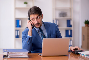 Young businessman employee working in the office