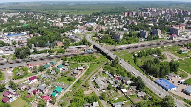 Aerial view of an overpass and a moving train (Glazov, Republic of Udmurtia, Russia)
