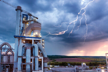 Night plant in storm and lightning