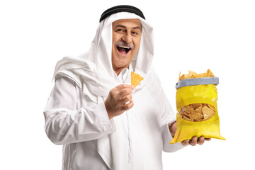 Cheerful mature arab man eating tortilla chips