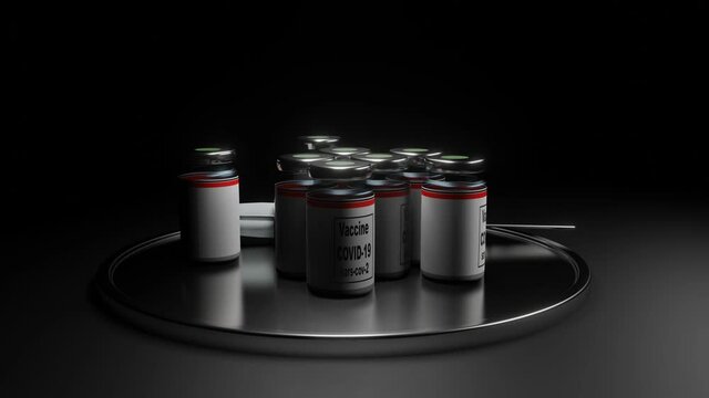 Covid 19 vaccine jars and a disposable plastic syringe rotate on a silver chrome tray against a black background. coronavirus pandemic concept. 3d render