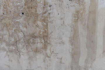 abstract background of an old shabby painted grey concrete wall close up