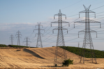 Power lines in the field, electric towers.