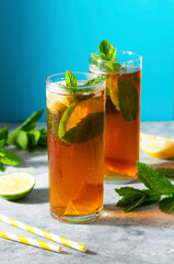 Cold tea, summer refreshing drink with mint leaves and lime.