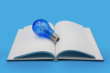Blue light bulb on open blank notebook on blue background , education with intellectual and wisdom concept