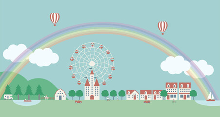 虹のかかる空と観覧車のある田舎と街の風景。