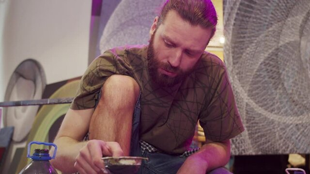 A talented painter is filtering paints 