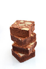 Four pieces of delicious homemade brownie stack on white background