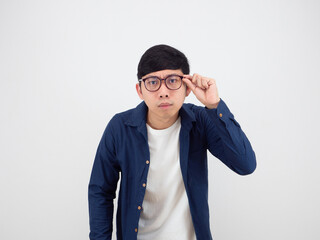 Man wearing glasses feeling doubt looking at camera portrait on white background