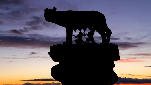 She-wolf breastfeeding romulus and, remus , symbol of Rome, Timelapse at Twilight, Italy