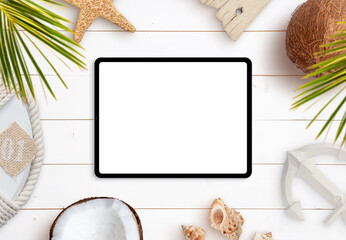 Fototapeta na wymiar Tablet mockup on white wooden desk surrounded with palm leaves, starfish, shells, coconuts, lifebelt and anchor. Summer, travel, top view, flat lay beach composition
