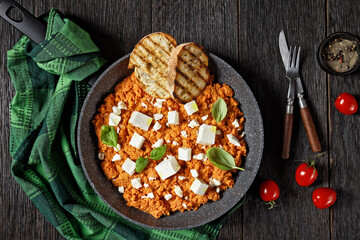 eggs scrambled with tomatoes and feta cheese