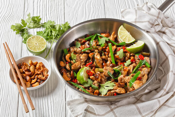 Thai cashew chicken stir fry in a pan