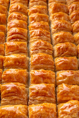 Turkish desert baklava with peanut, pistachio for holiday or ramadan. Traditional Middle Eastern Flavors. Selective focus, pattern.