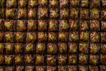 Turkish desert baklava with peanut, pistachio for holiday or ramadan. Traditional Middle Eastern Flavors. Selective focus, pattern.