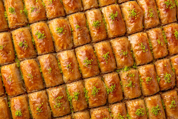 Turkish desert baklava with peanut, pistachio for holiday or ramadan. Traditional Middle Eastern Flavors. Selective focus, pattern.