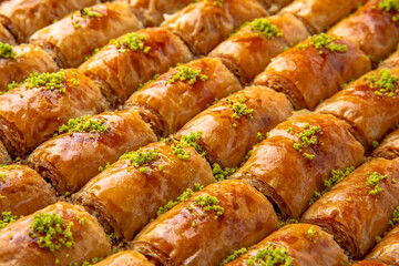 Turkish desert baklava with peanut, pistachio for holiday or ramadan. Traditional Middle Eastern Flavors. Selective focus, pattern.