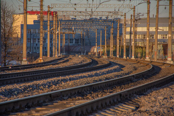 Naklejka na ściany i meble the branching of railways against the background of evening sunlight