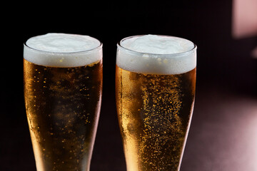 closeup glass of beer with foam