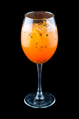 Cocktail Aperol Spritz with passionfruit on a dark background. Isolated