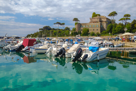 Dockyard with boats and medieval castle on the background , Santa Marinella , Rome , Italy