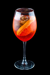 Aperol Spritz cocktail with grapefruit on a dark background. Isolated