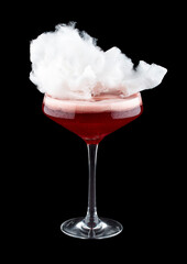 Cherry cocktail with cotton candy on a dark background. Isolated