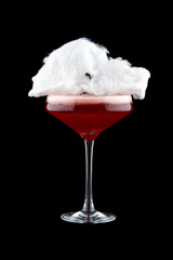 Cherry cocktail with cotton candy on a dark background. Isolated