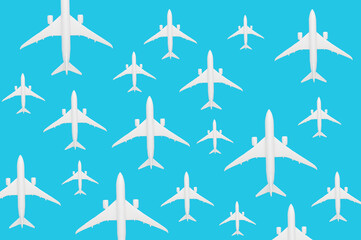 Pattern made of toy airplanes on pastel blue background. Flat lay design 
