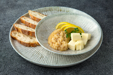 Pike caviar with butter and baguette. Delicious appetizer. Ready menu for the restaurant. Neutral gray blue textured background