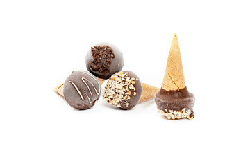 Italian artisan ice cream in small cones, mixed flavors in white background