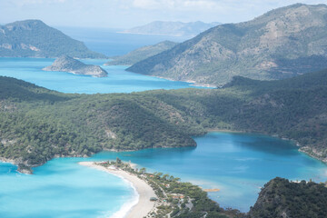 Obraz premium A beautiful sea bay with a sandy beach.